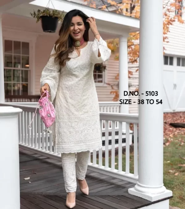 Girl wearing a white beautiful heavy chicken sequence work Kurti from dailyimprovise, and having a smile on her face