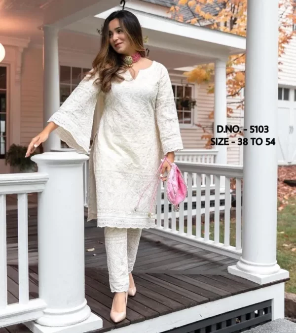 Girl wearing a white beautiful heavy chicken sequence work Kurti from dailyimprovise, and looking elegant