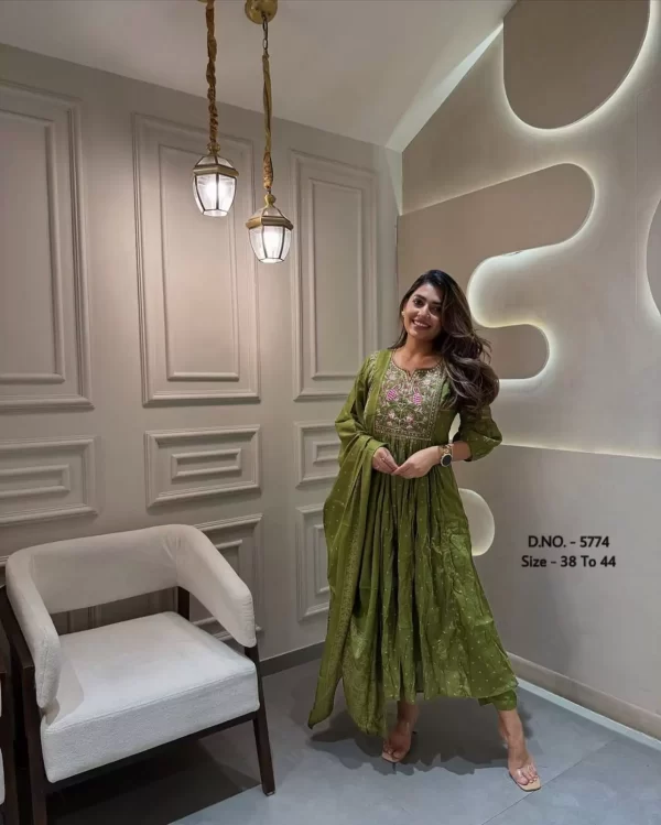 Girl wearing a Elegant Bandhej Printed Cotton Kurti Set – Flared Embroidered Suit with Mulmul Dupatta from dailyimprovise, and posing for photo