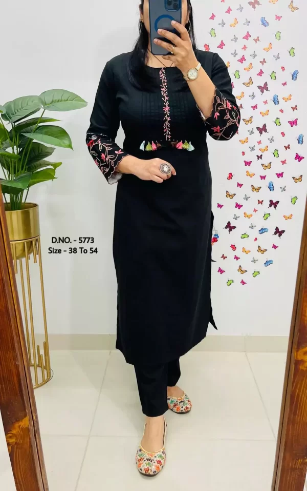 Girl wearing a black Elegant Cotton Slub Kurti Pant Cord Set – Hand Aari Embroidery & Pintex Work from dailyimprovise, and clicking selfie