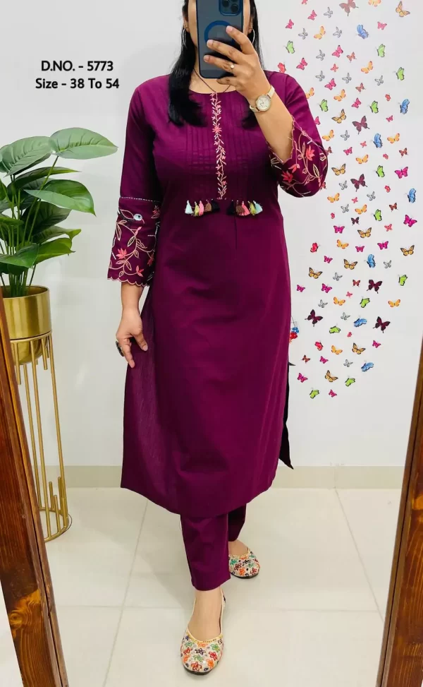 Girl wearing a purple Elegant Cotton Slub Kurti Pant Cord Set – Hand Aari Embroidery & Pintex Work from dailyimprovise, and posing for photo