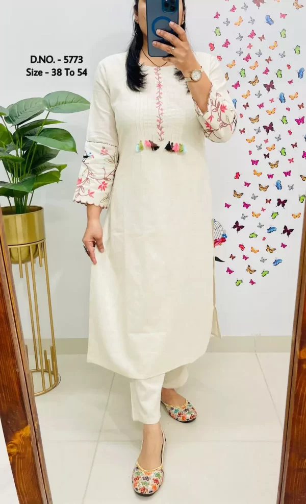 Girl wearing a white Elegant Cotton Slub Kurti Pant Cord Set – Hand Aari Embroidery & Pintex Work from dailyimprovise