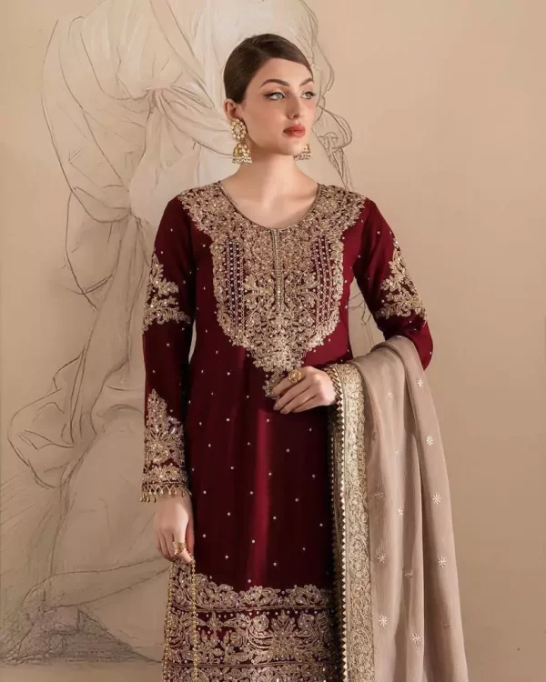 Girl wearing a red Elegant Georgette Kurti Sharara Set – Heavy Sequins Embroidery with Dupatta from dailyimprovise, and posing for photo