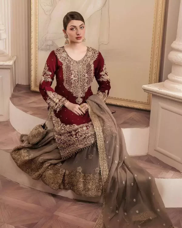 Girl wearing a red Elegant Georgette Kurti Sharara Set – Heavy Sequins Embroidery with Dupatta from dailyimprovise, and posing for photo