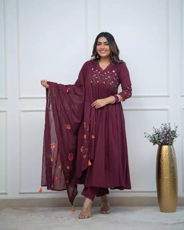 Girl wearing a Elegant Pure Cotton Embroidered Suit Set – 3-Piece Ethnic Wear from dailyimprovise, and its a candid photo