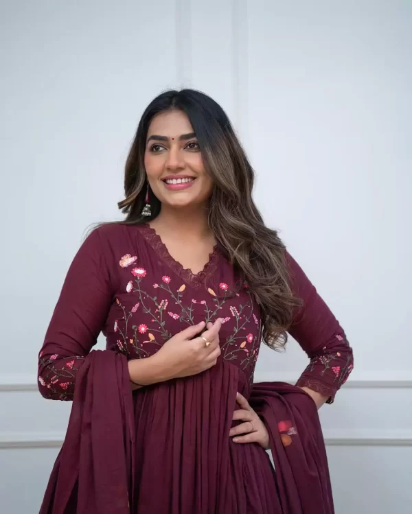 Girl wearing a Elegant Pure Cotton Embroidered Suit Set – 3-Piece Ethnic Wear from dailyimprovise, and having a smile on her face