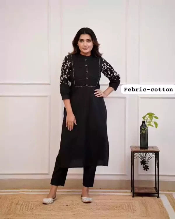 Model wearing black embroidered rayon pant set for women