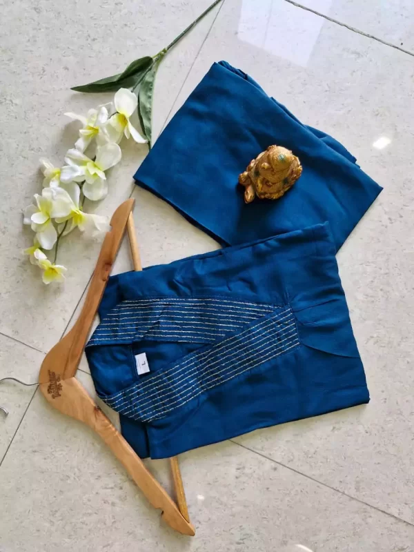 Blue folded Stylish Heavy Rayon Cord-Set Suit with V-Neck & Matching Pants from dailyimprovise
