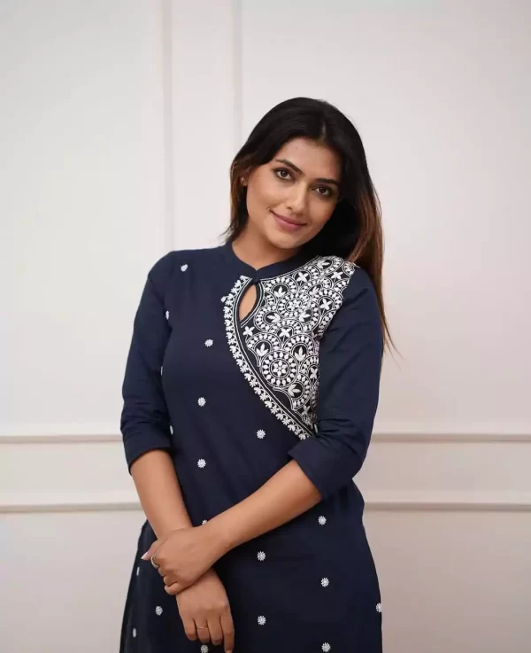 Model in dark blue embroidered rayon kurti and pant set