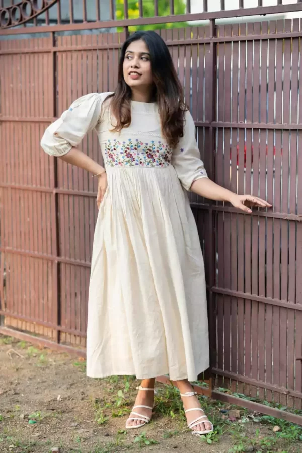 Girl Wearing a white rayon dress floral embroidery crochet lace cross leg from dailyimprovise