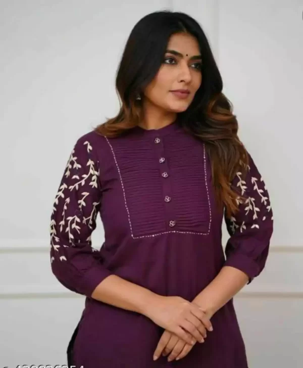 Model in maroon embroidered rayon pant set with festive styling