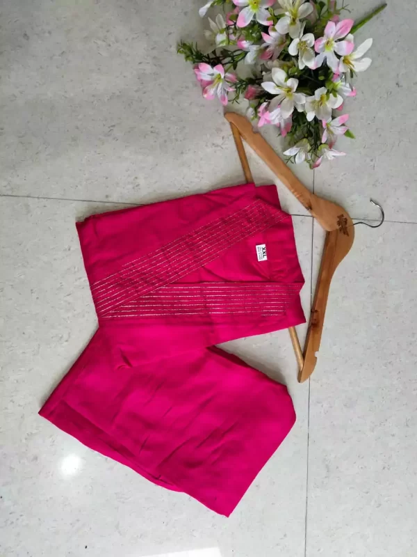 pink folded Stylish Heavy Rayon Cord-Set Suit with V-Neck & Matching Pants from dailyimprovise