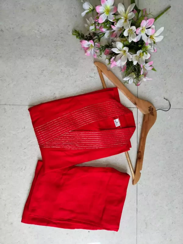 red folded Stylish Heavy Rayon Cord-Set Suit with V-Neck & Matching Pants from dailyimprovise