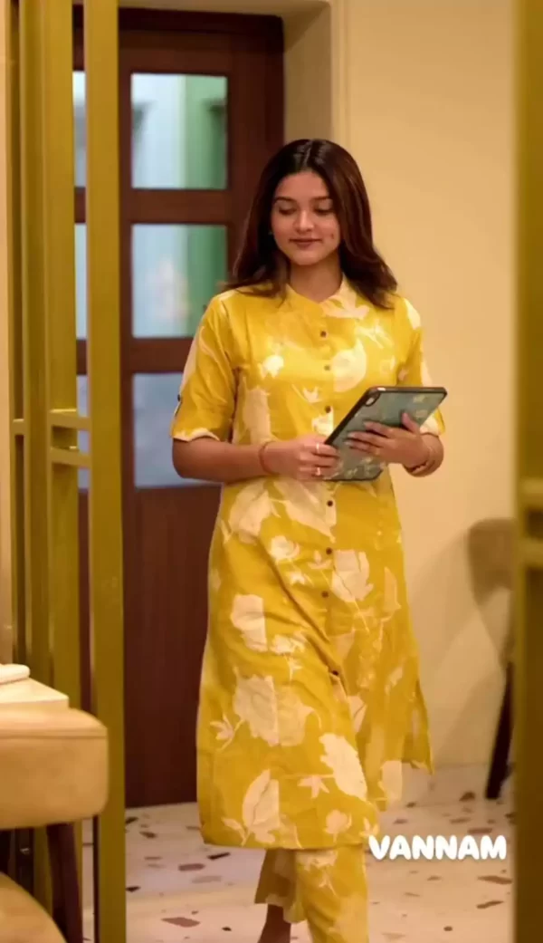Model in yellow floral Jaipuri cotton co-ord kurti and pant set
