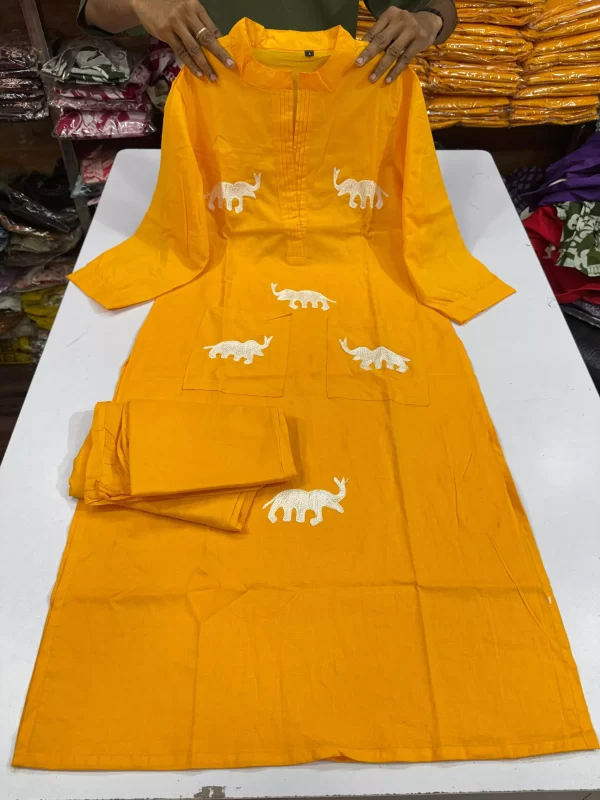 Yellow color Regal Elephant Dhaga Embroidery Cord Set – Pure Cotton V-Neck Suit with Pockets from dailyimprovise